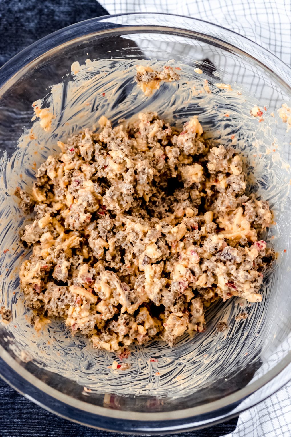 ground venison combined with pimento cheese spread in a  large mixing bowl