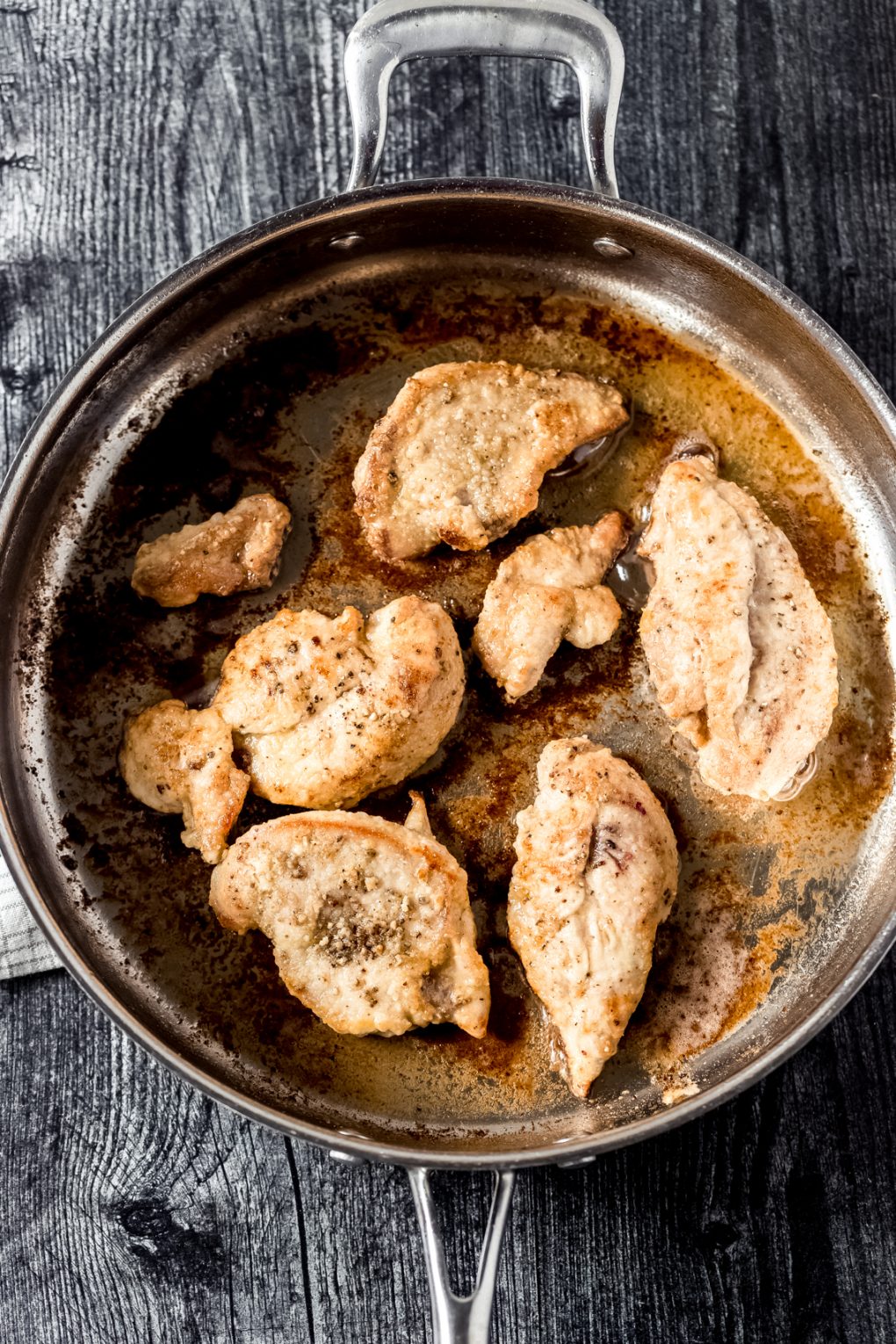 pheasant breasts sautéing in a skillet