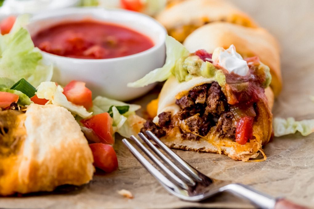 a venison taco ring with a serving cut out