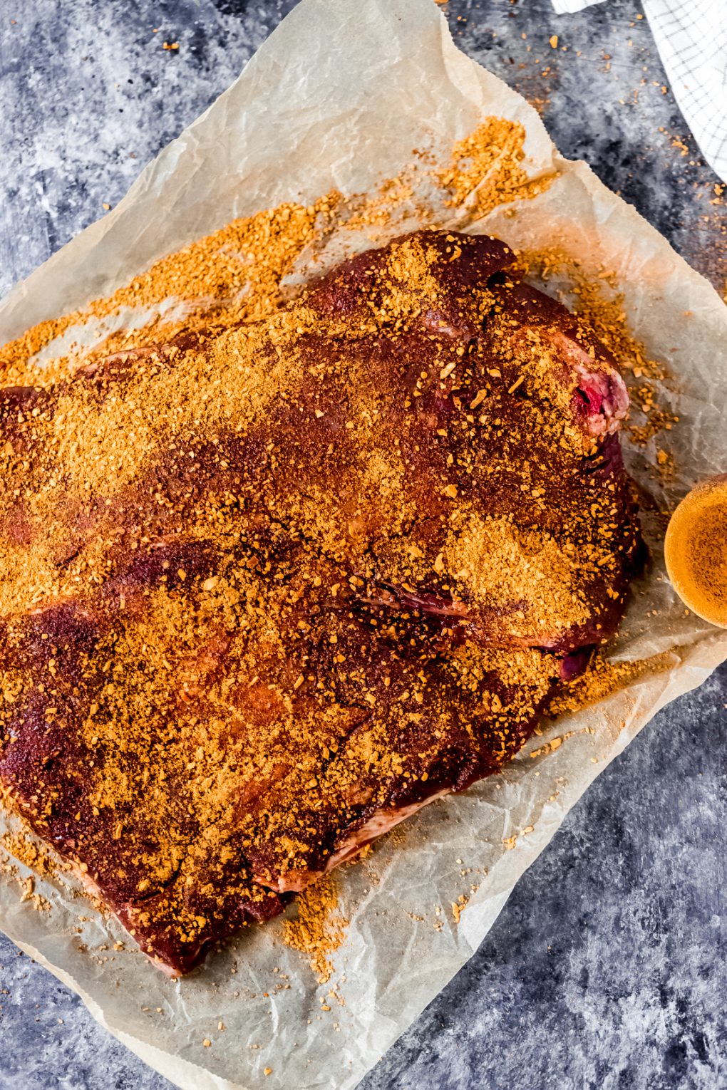 an elk brisket with BBQ rub all over it