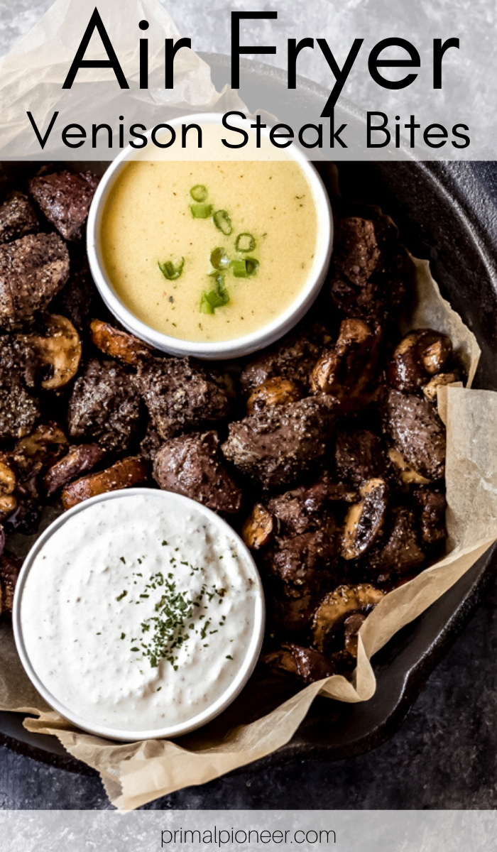 air fryer venison steak bites in a skillet with two dipping sauces