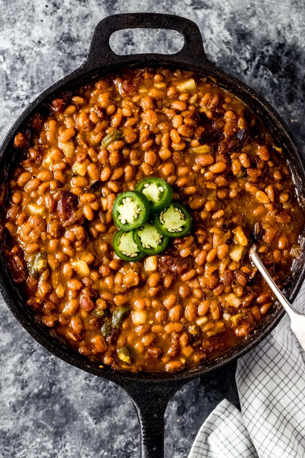 a cast iron skillet of smoked baked beans