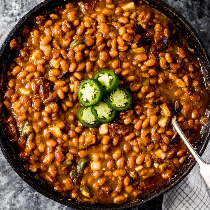 a cast iron skillet of smoked baked beans