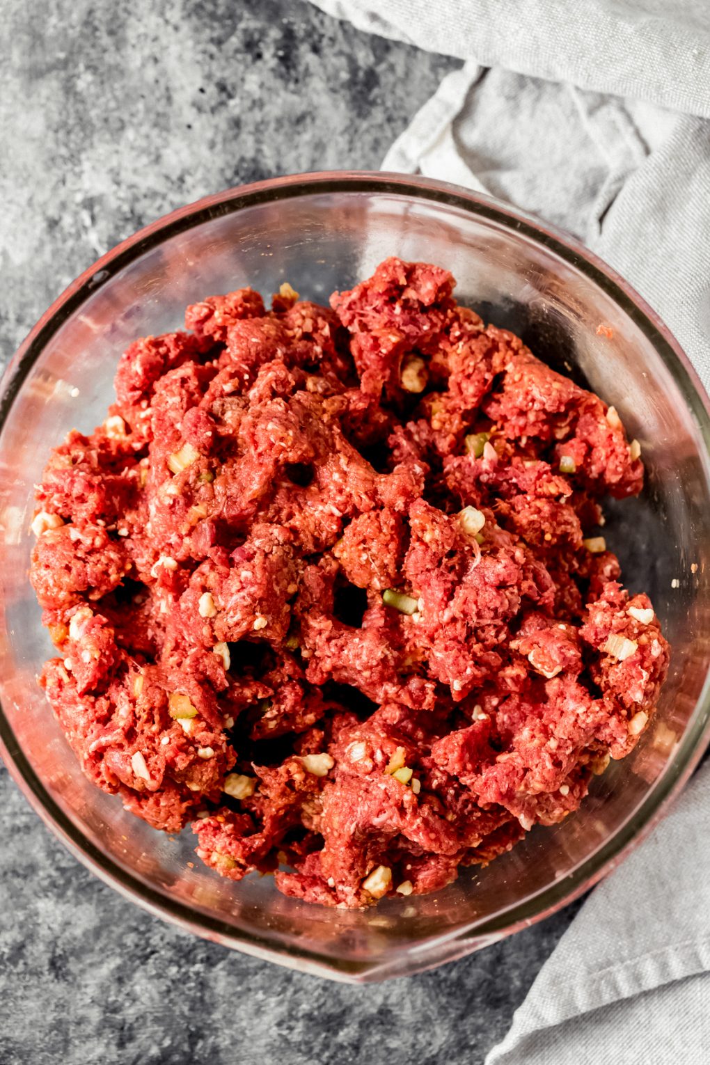 ground bison meat in a bowl to make spicy buffalo bison burgers