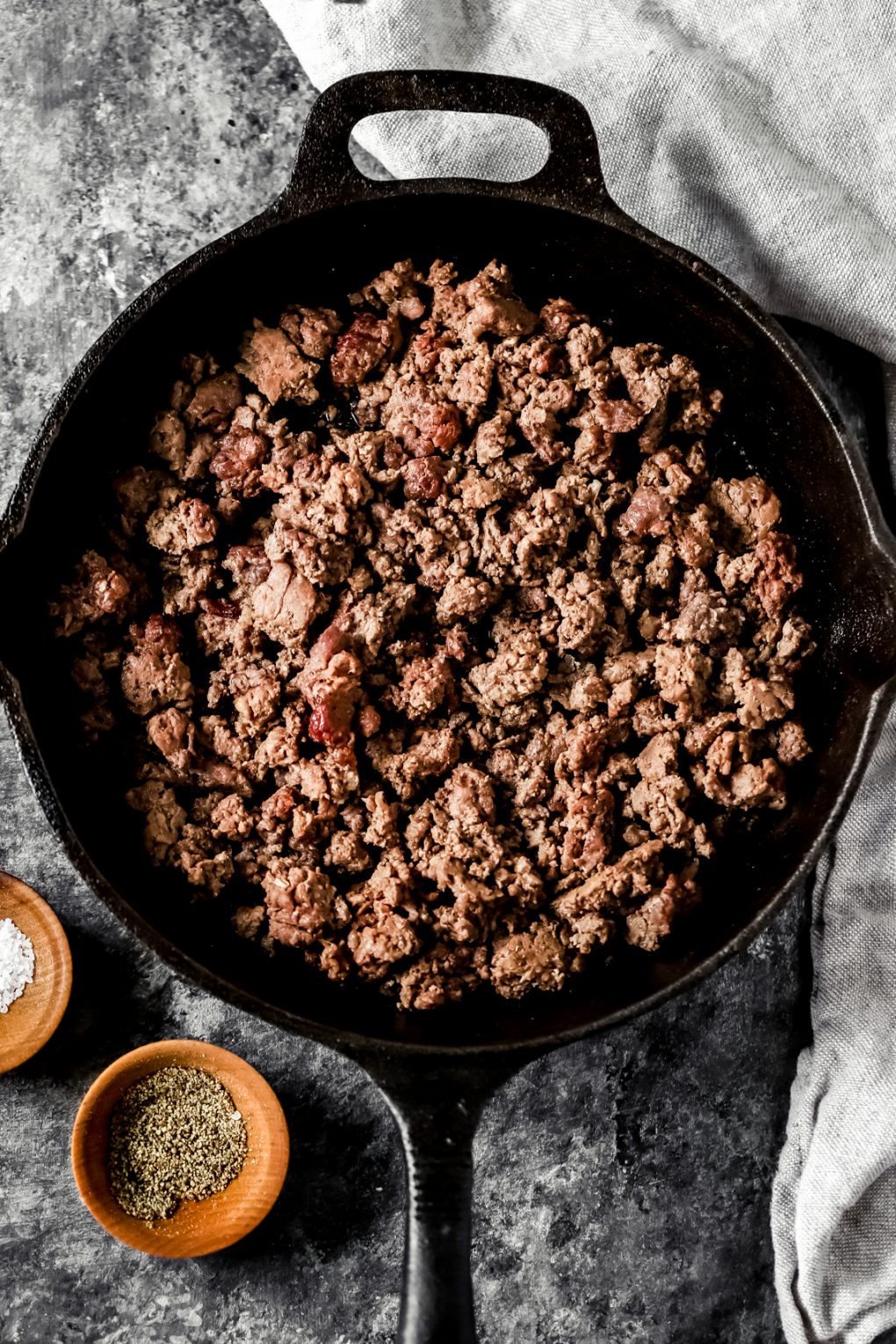 a skillet of smoked ground venison on a table