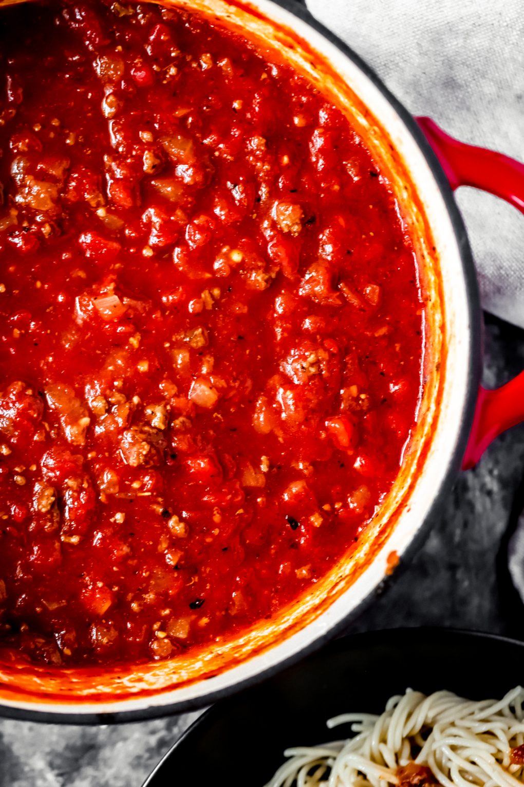a large pot of spaghetti sauce with ground deer meat
