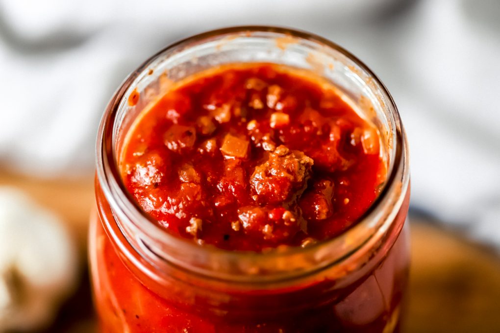 a jar with homemade spaghetti sauce made with round venison