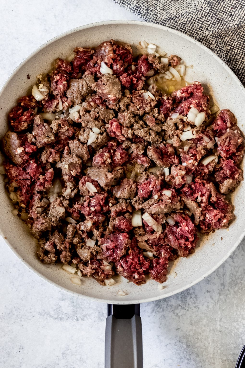 ground venison cooking in a skillet