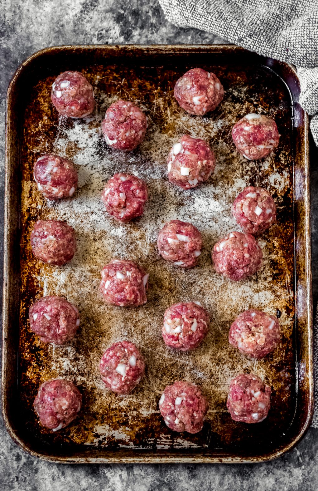 a pan of unbaked ground venison meatballs