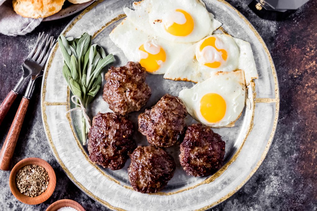 a platter of venison breakfast sausage and eggs