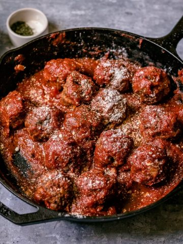 a skillet of Traeger smoked meatballs