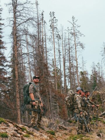group of elk hunters standing on a mountain