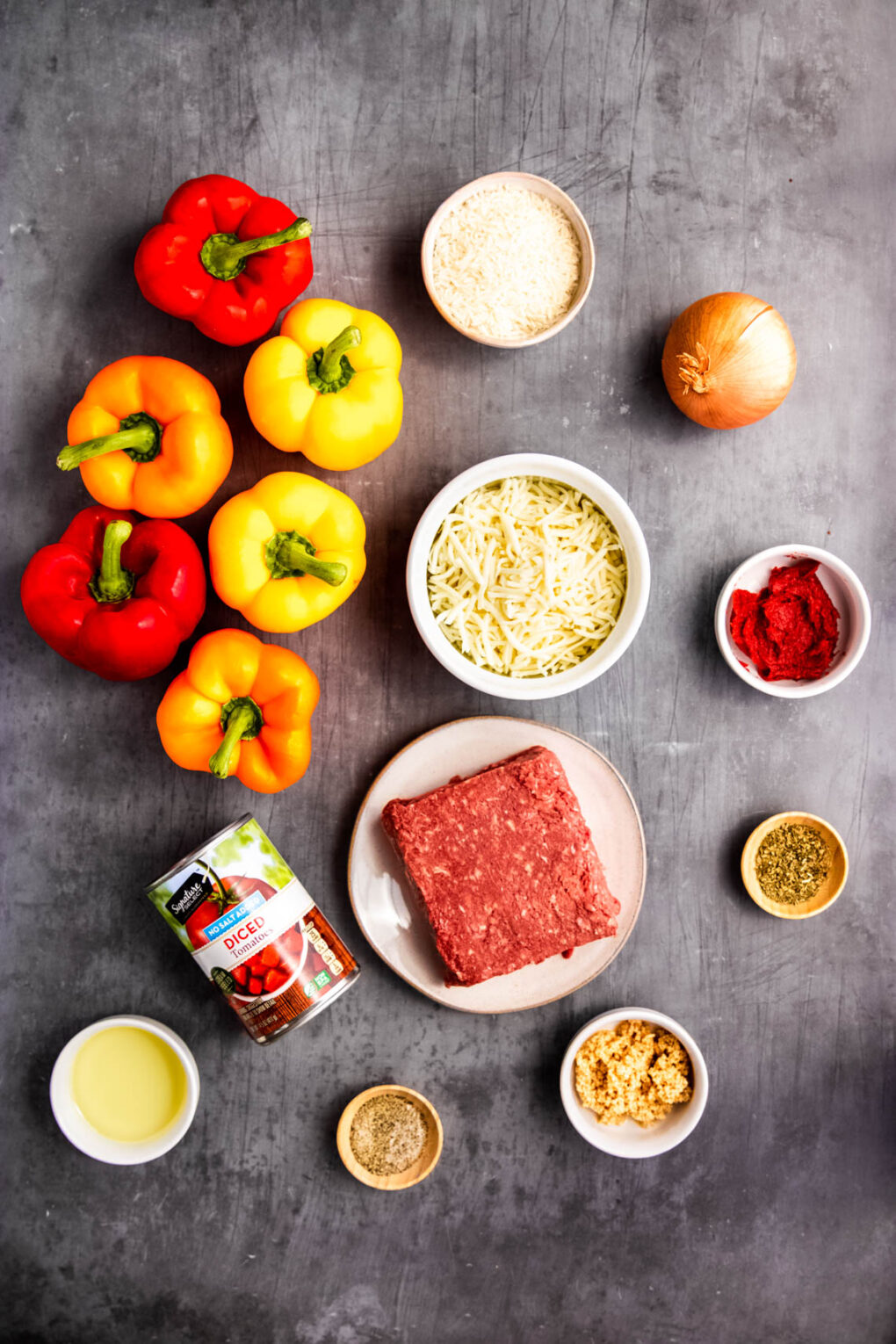 A photo of ingredients including the bell peppers, meat, tomatoes, cheese, onions, and more!